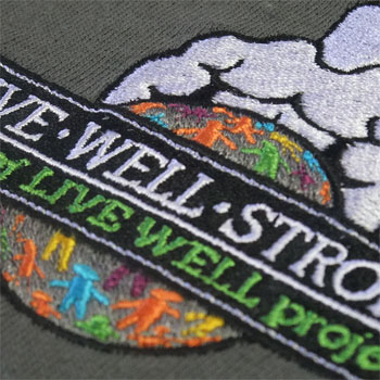 photo of Live Well Strong polo shirt embroidery